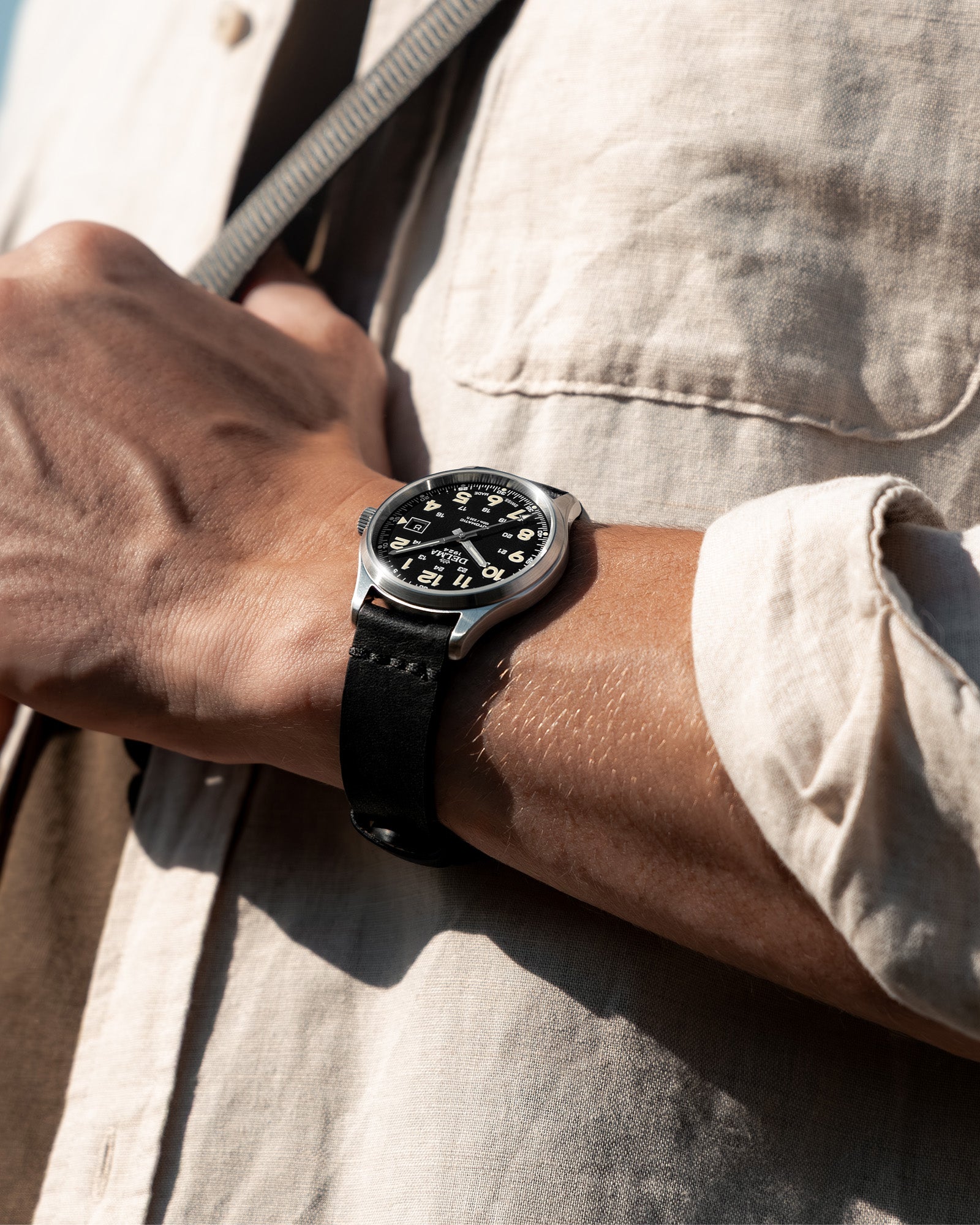 DELMA Commander 40 mm stainless steel watch with black dial and black leather strap