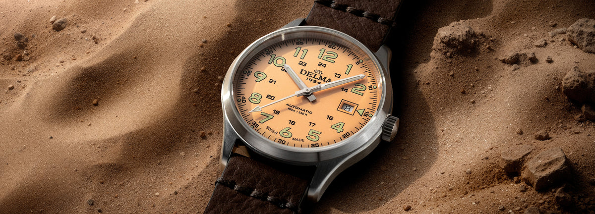 DELMA Commander 40 mm stainless steel watch with salmon dial and brown leather strap in context