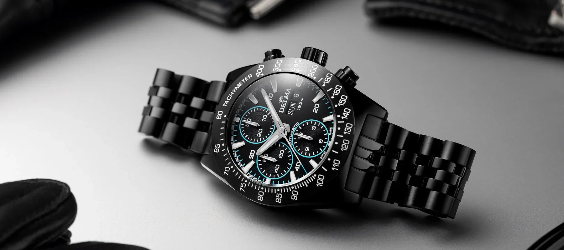 Delma Montego Black Edition neon blue details black DLC stainless steel bracelet