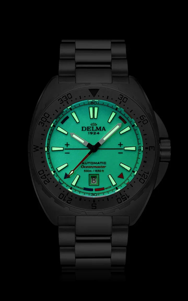 Delma Oceanmaster Lume green dial stainless steel bracelet dark