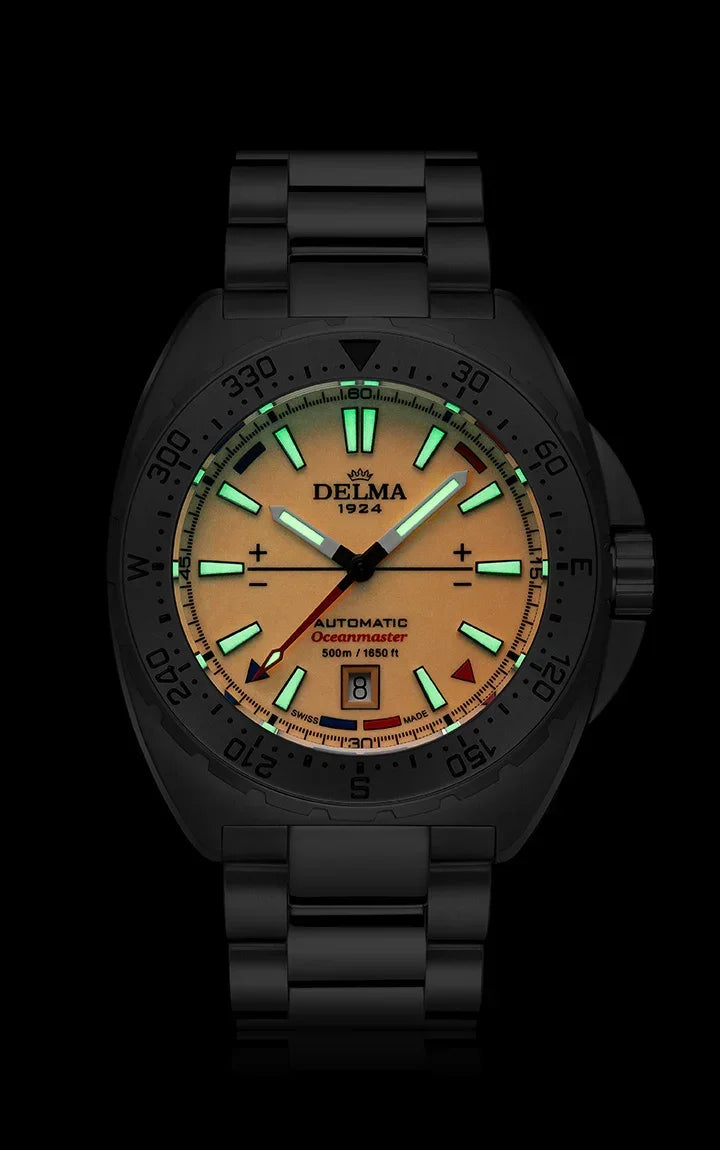 Delma Oceanmaster Lume orange dial stainless steel bracelet dark