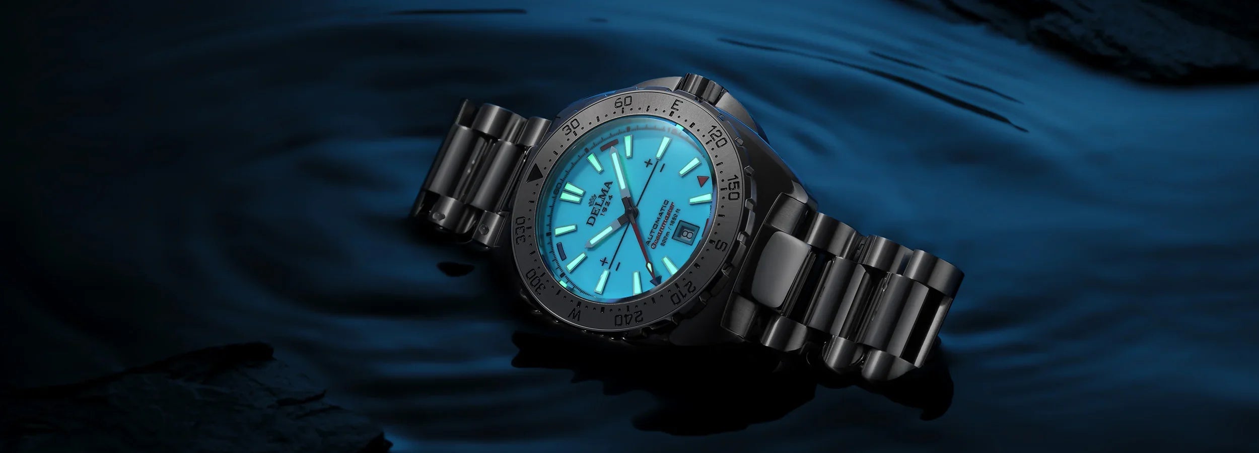 Delma Oceanmaster Lume blue dial stainless steel bracelet dark