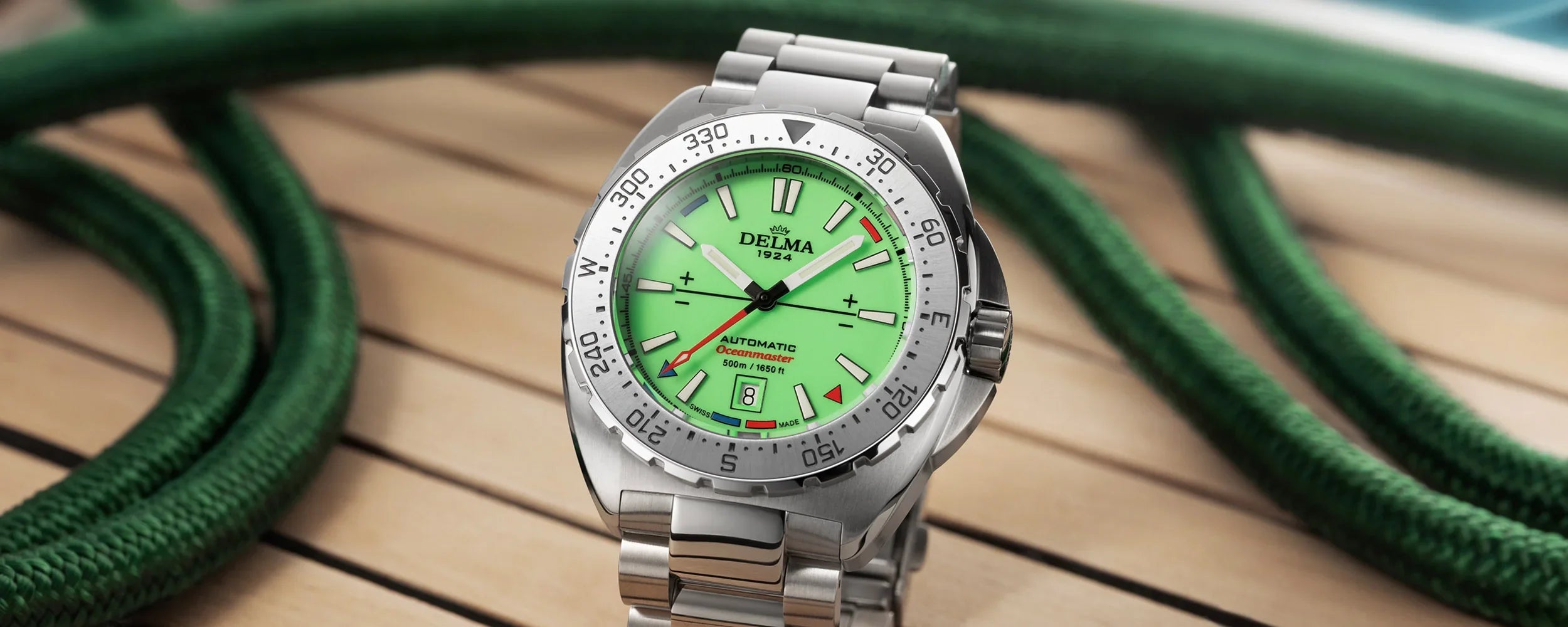 Delma Oceanmaster Lume green dial stainless steel bracelet