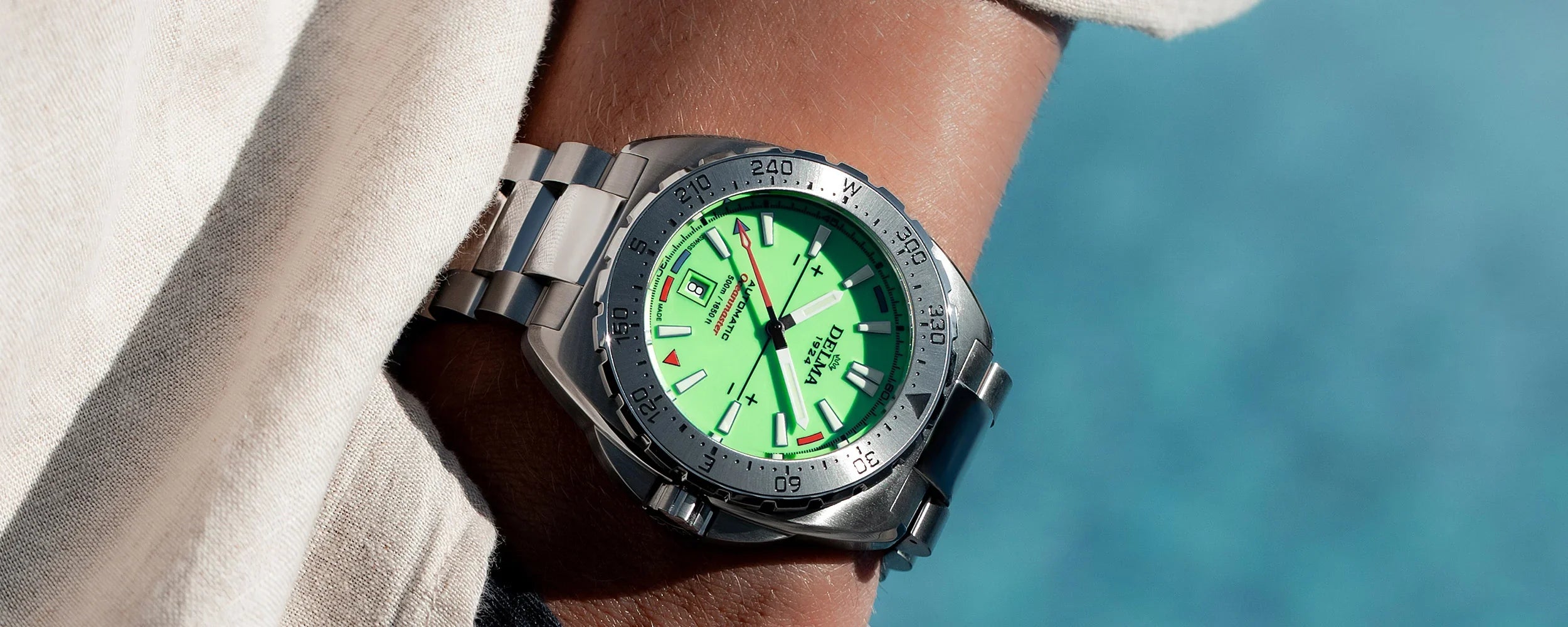 Delma Oceanmaster Lume green dial stainless steel bracelet