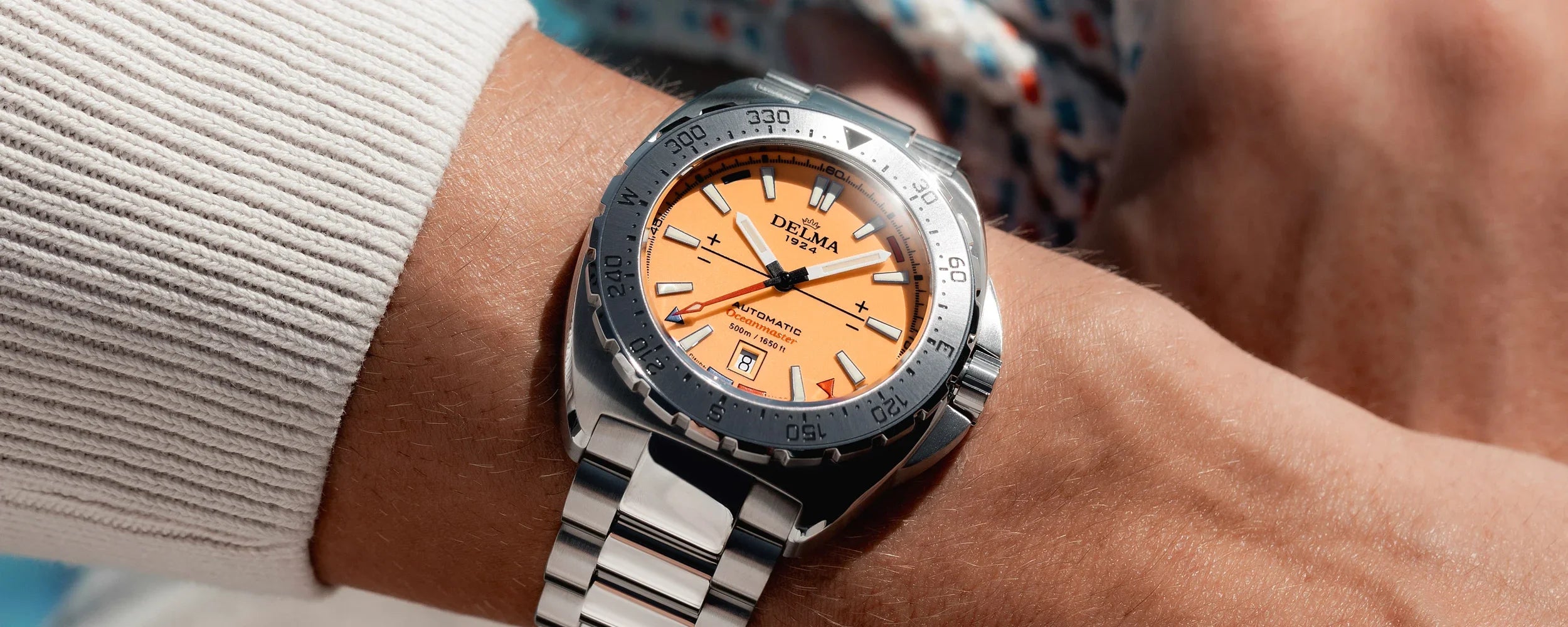 Delma Oceanmaster Lume orange dial stainless steel bracelet