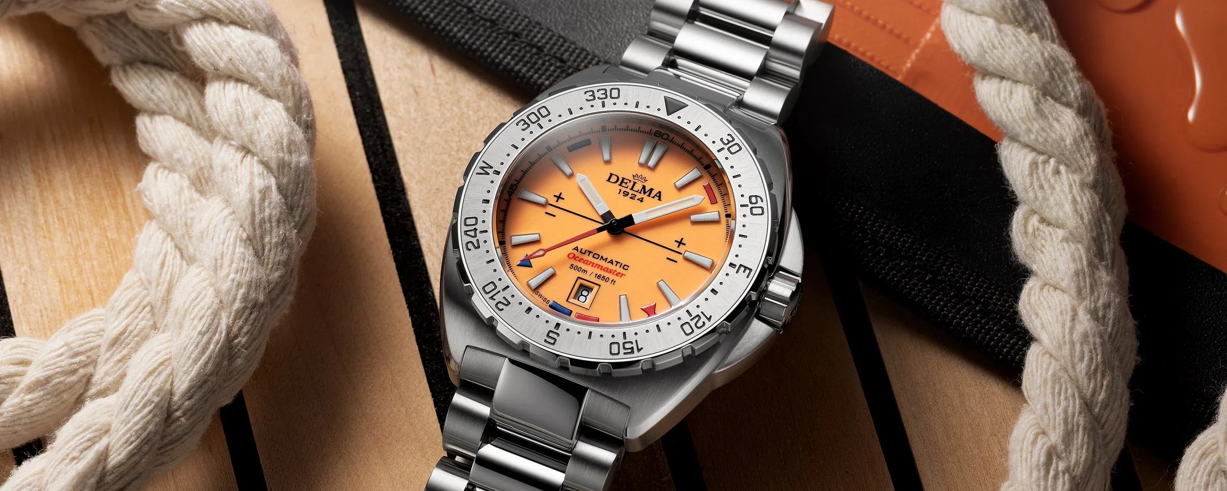 Delma Oceanmaster Lume orange dial stainless steel bracelet