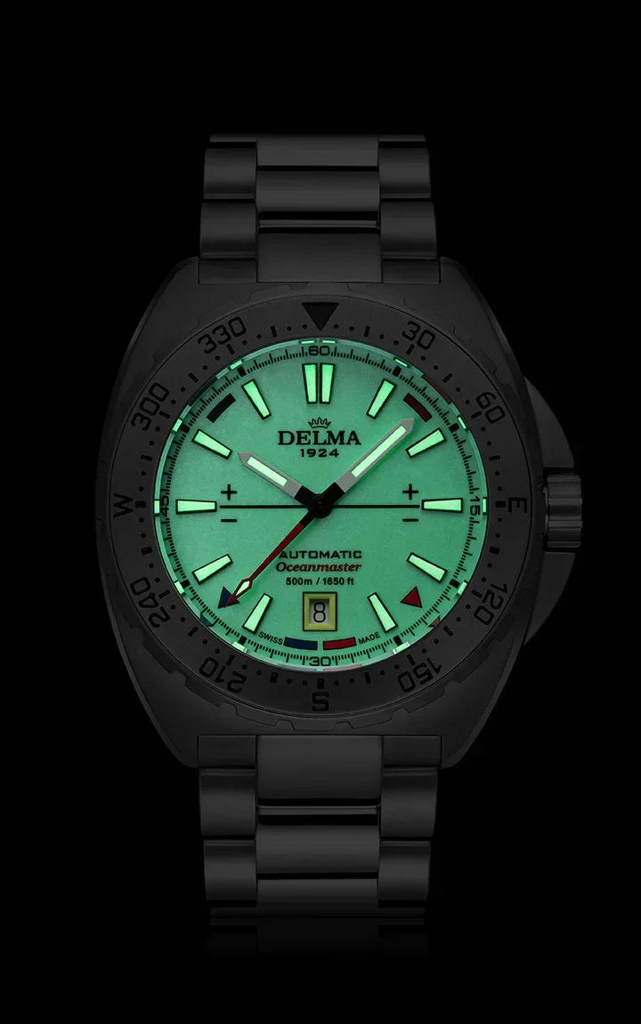 Delma Oceanmaster Lume yellow dial stainless steel bracelet dark