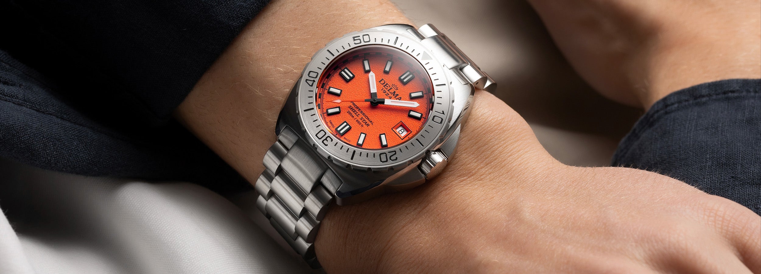 Delma Shell Star 41mm orange dial stainless steel bracelet