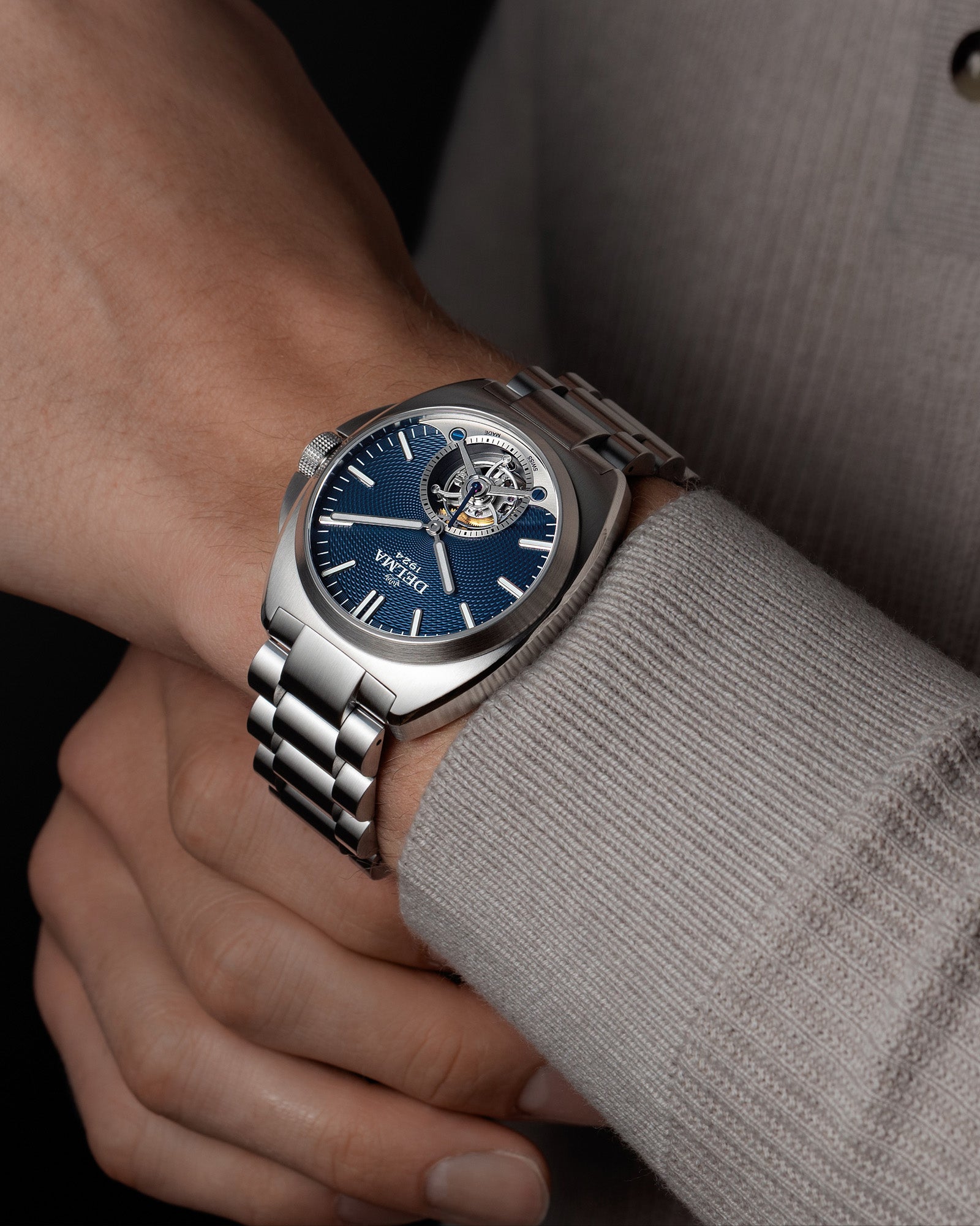 DELMA 1924 Tourbillon stainless steel watch with blue dial on wrist