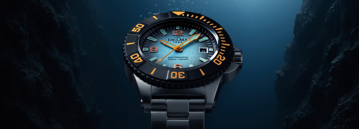 DELMA Blue Shark IV stainless steel watch with blue gradient dial and black bezel under water