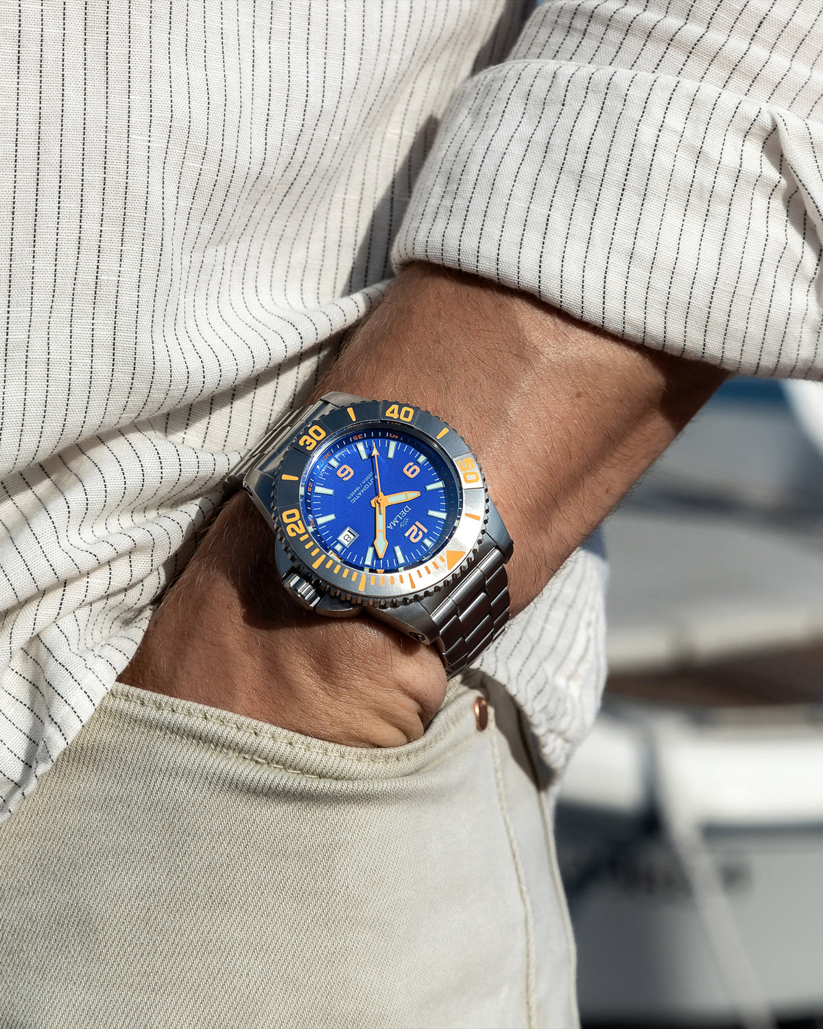 DELMA Blue Shark IV stainless steel watch with blue dial on wrist