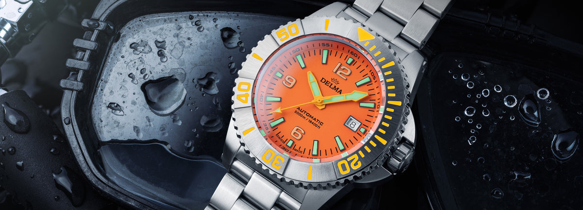 DELMA Blue Shark IV stainless steel watch with orange dial in context