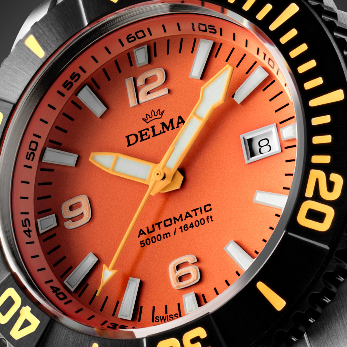 DELMA Blue Shark IV stainless steel watch with orange dial and black bezel close up