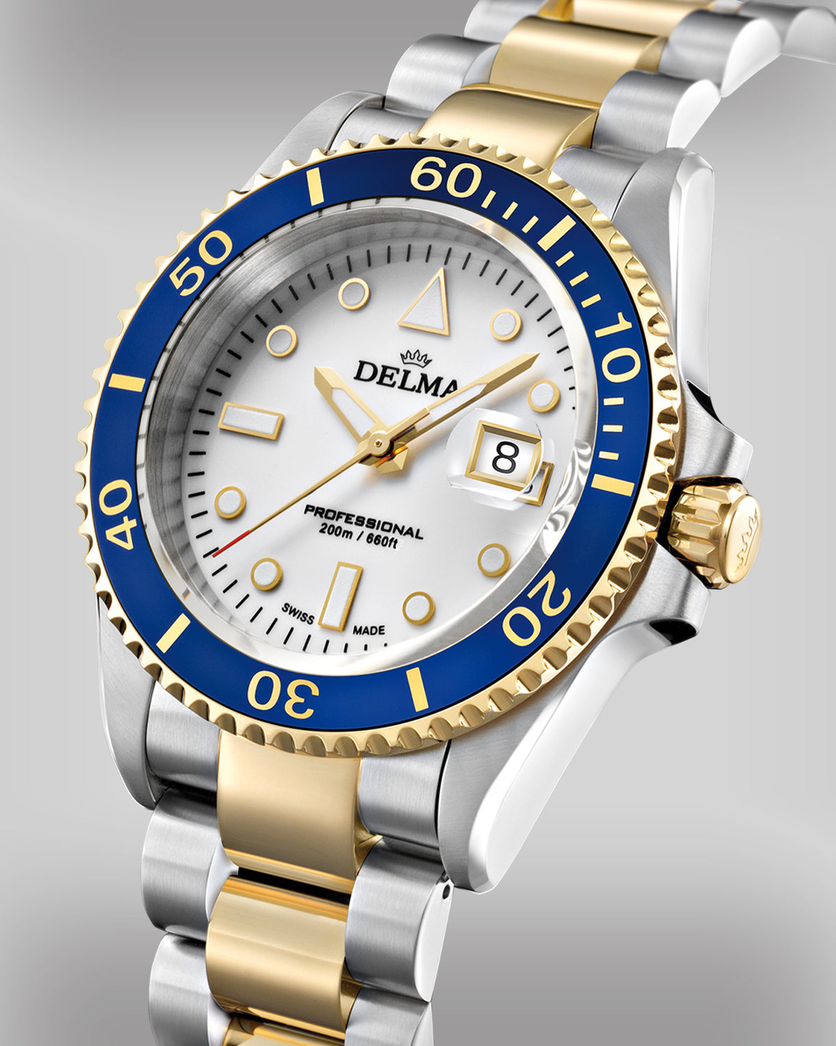 DELMA Commodore two tone stainless steel and yellow gold PVD watch with white dial and blue bezel side view