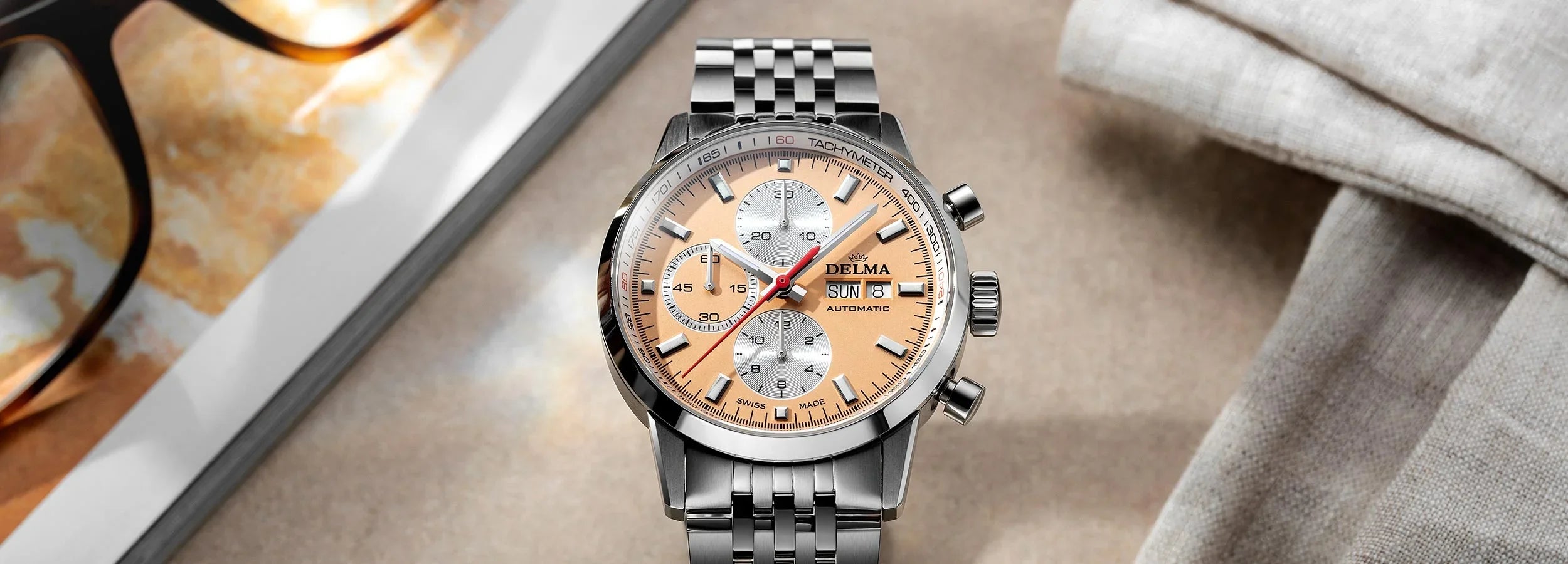 Delma Continental orange dial stainless steel bracelet