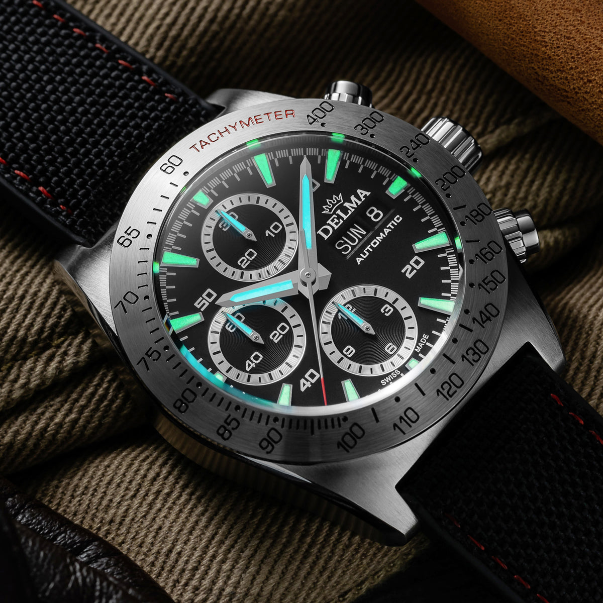 DELMA Montego stainless steel watch with black dial and black Cordura strap lume