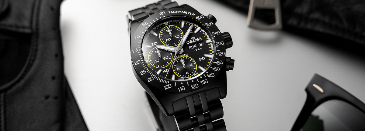 DELMA Montego Black Edition black DLC stainless steel watch with black dial and yellow accents in context