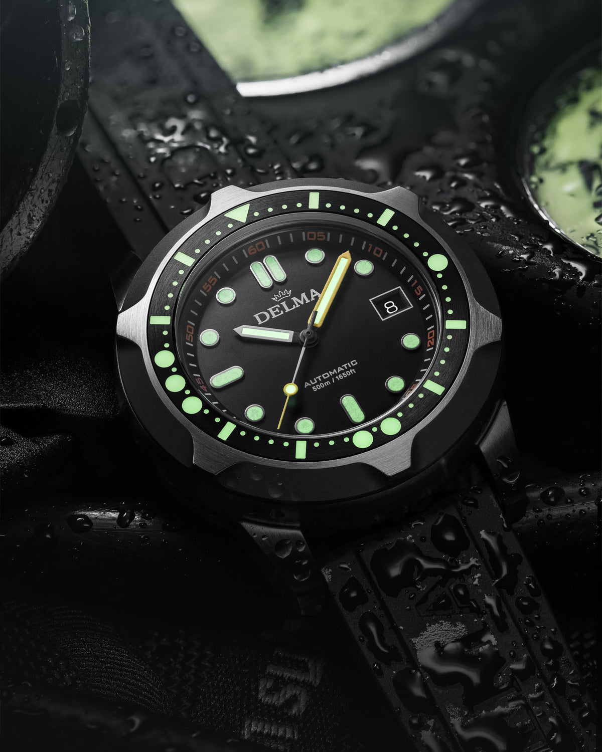 DELMA Quattro stainless steel watch with black dial and black bezel lume