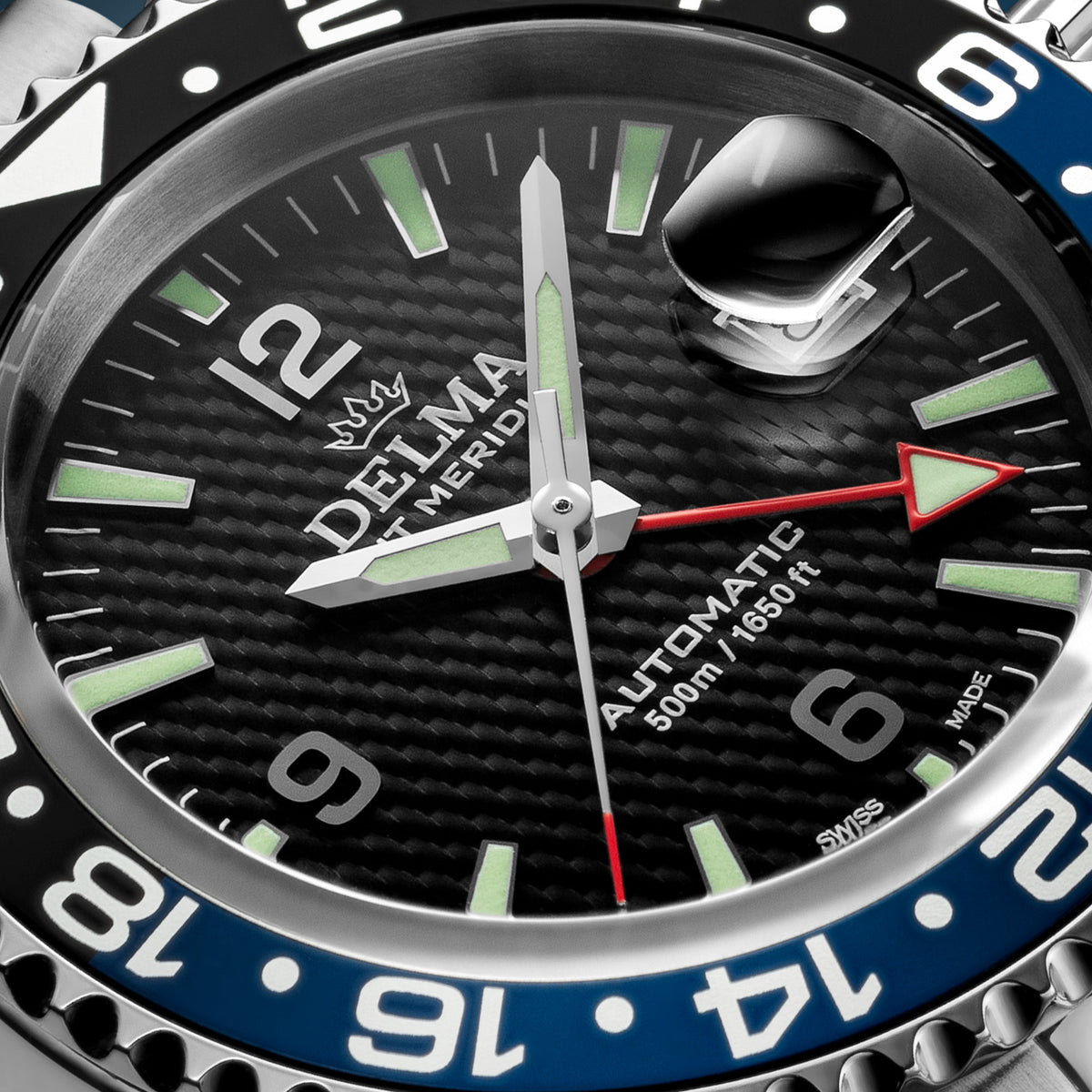 DELMA Santiago GMT Meridian Automatic stainless steel watch with black dial and black and blue bezel close up