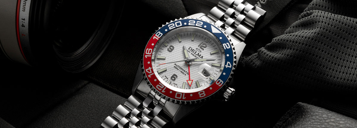 DELMA Santiago GMT Meridian Automatic stainless steel watch with white dial and blue and red bezel in context