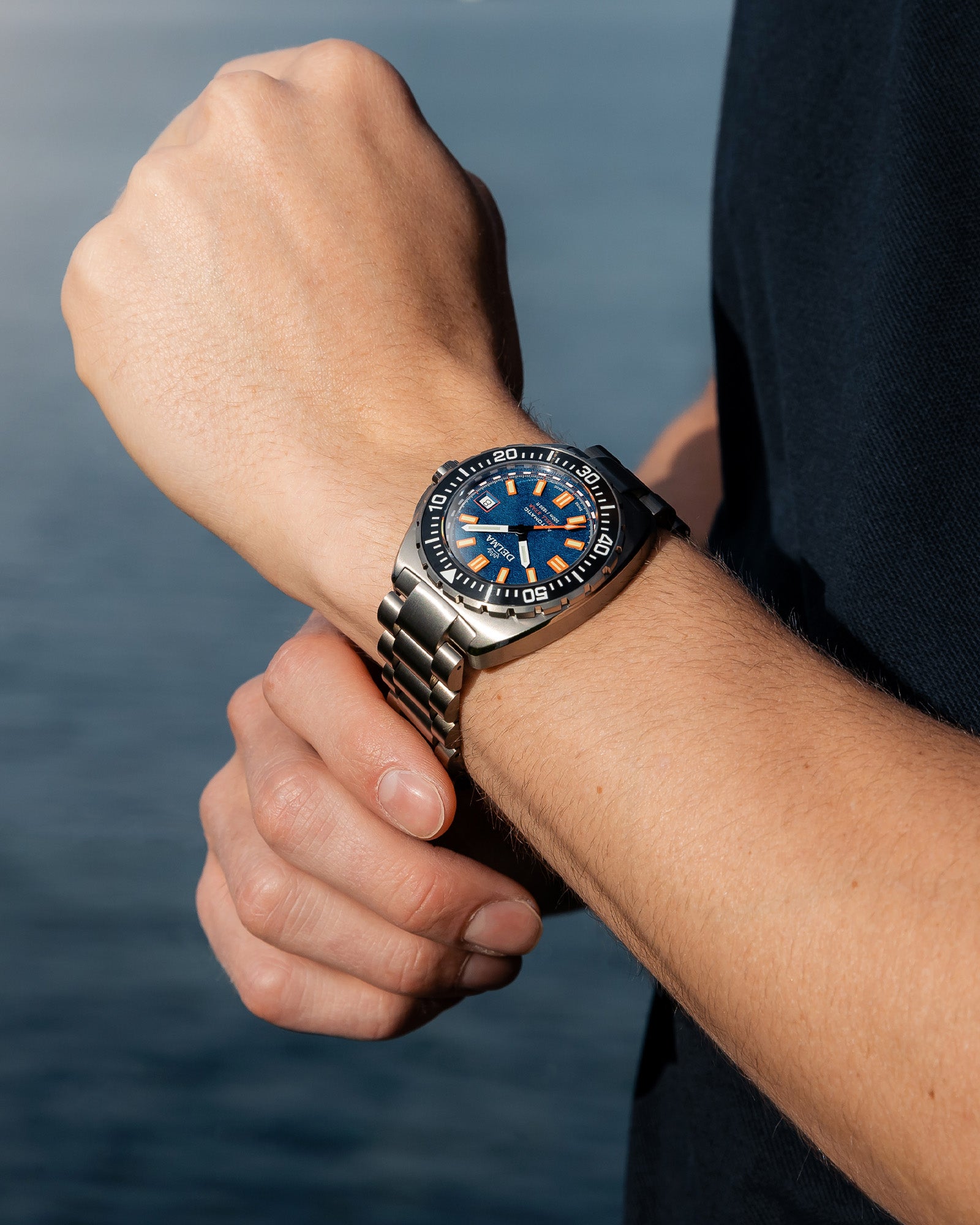 DELMA Shell Star Titanium watch with blue dial and black bezel