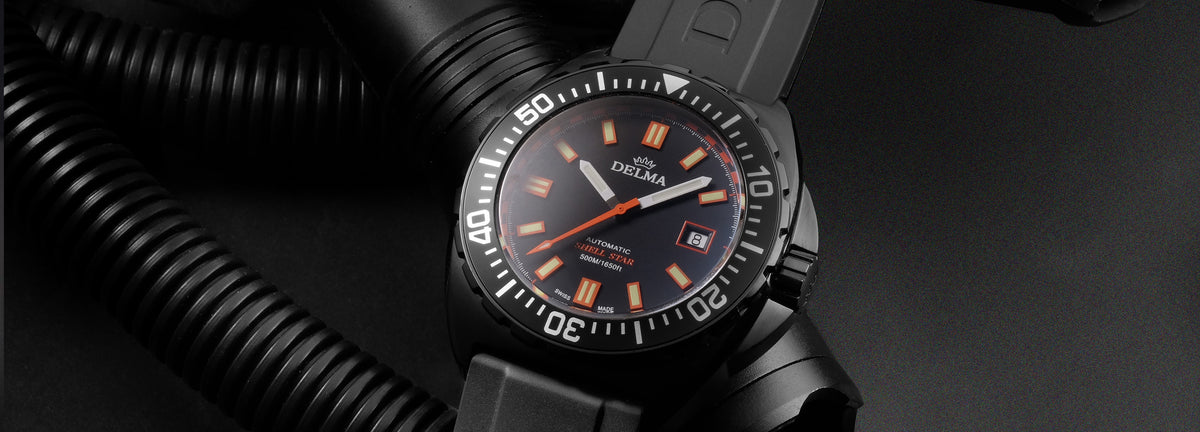 DELMA Shell Star Black Tag black DLC stainless steel watch with black bezel and black rubber strap with diver gear