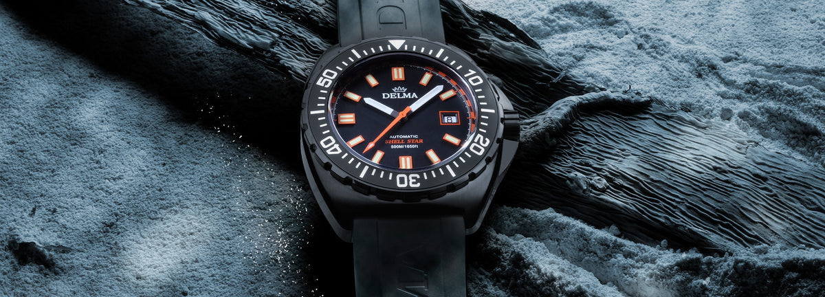 DELMA Shell Star Black Tag black DLC stainless steel watch with black bezel and black rubber strap underwater