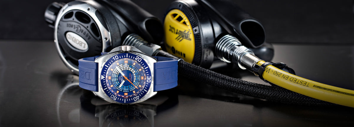 DELMA Shell Star Decompression Timer stainless steel watch with blue bezel in context
