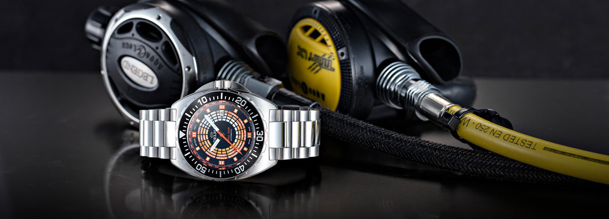 DELMA Shell Star Decompression Timer stainless steel watch with black bezel in context