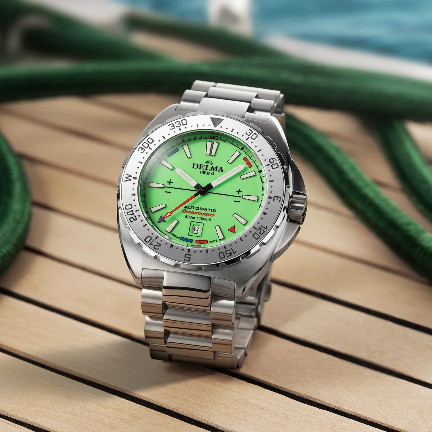 Delma Oceanmaster Lume green dial stainless steel bracelet