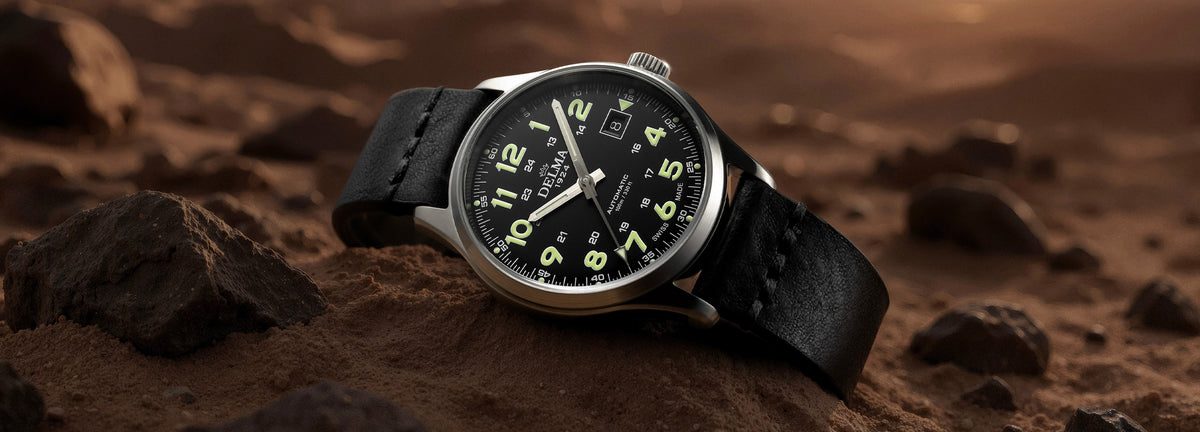 DELMA Commander 40 mm stainless steel watch with black dial and black leather strap in context