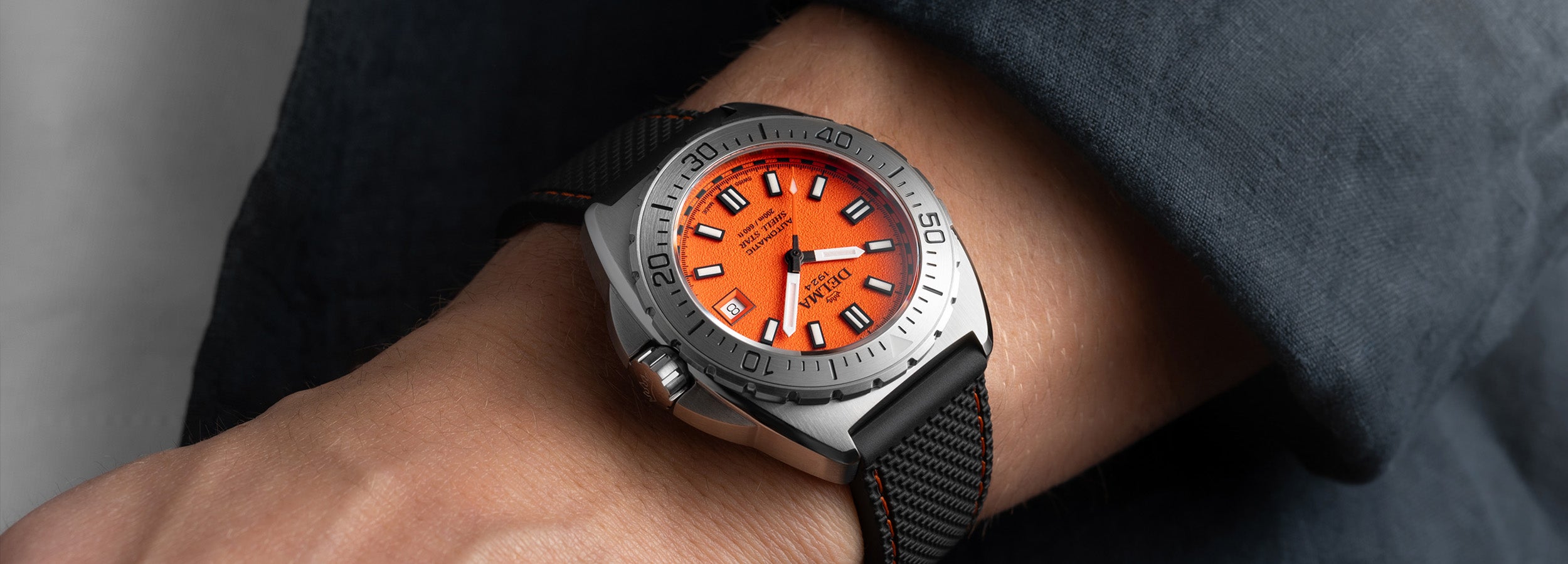 Delma Shell Star 41mm orange dial black rubber strap