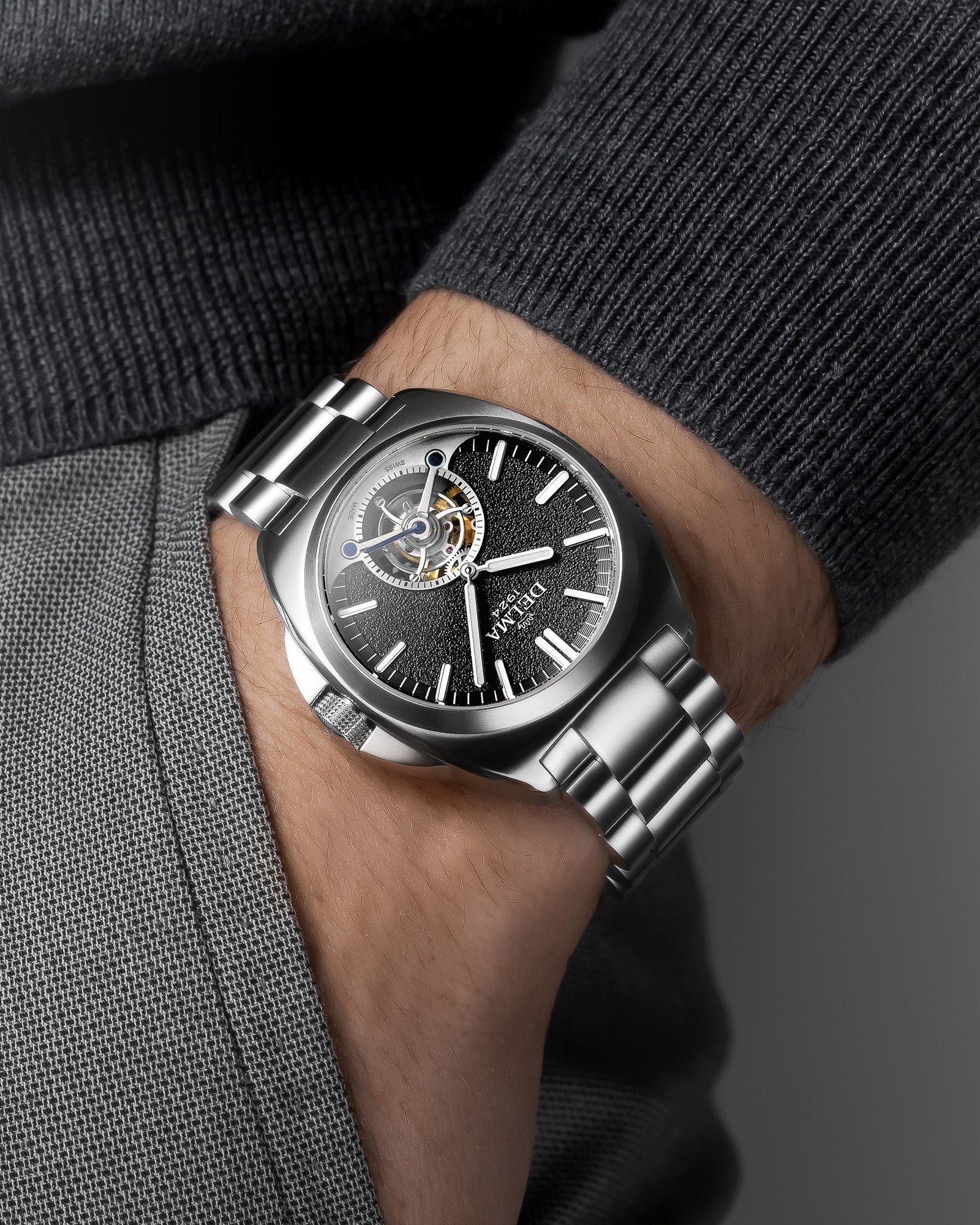 DELMA 1924 Tourbillon stainless steel watch with black dial on wrist