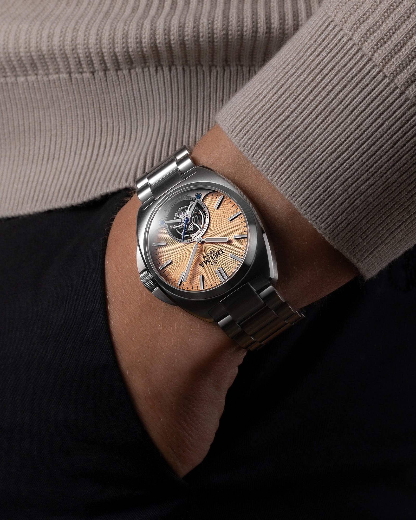 DELMA 1924 Tourbillon stainless steel watch with salmon dial on wrist