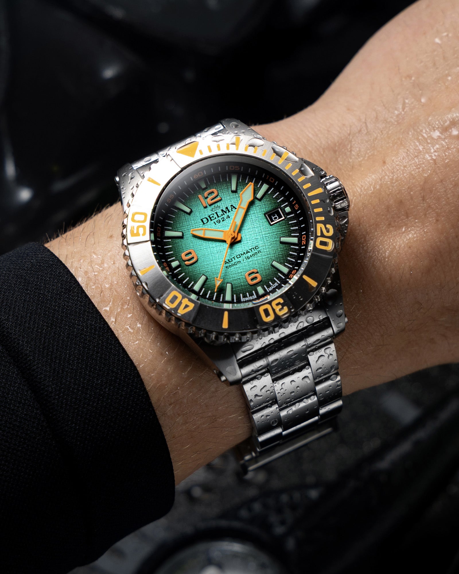 DELMA Blue Shark IV stainless steel watch with teal gradient dial wrist shot