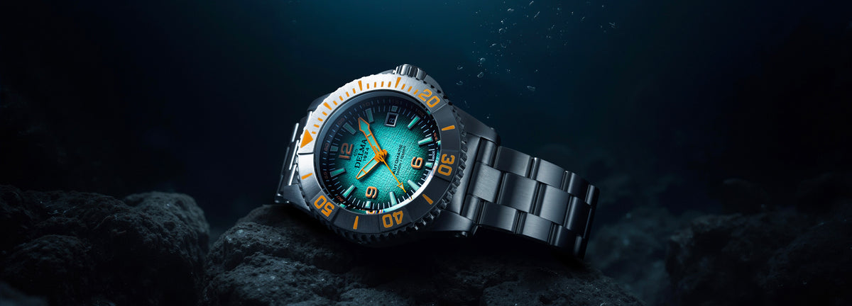 DELMA Blue Shark IV stainless steel watch with teal gradient dial under water