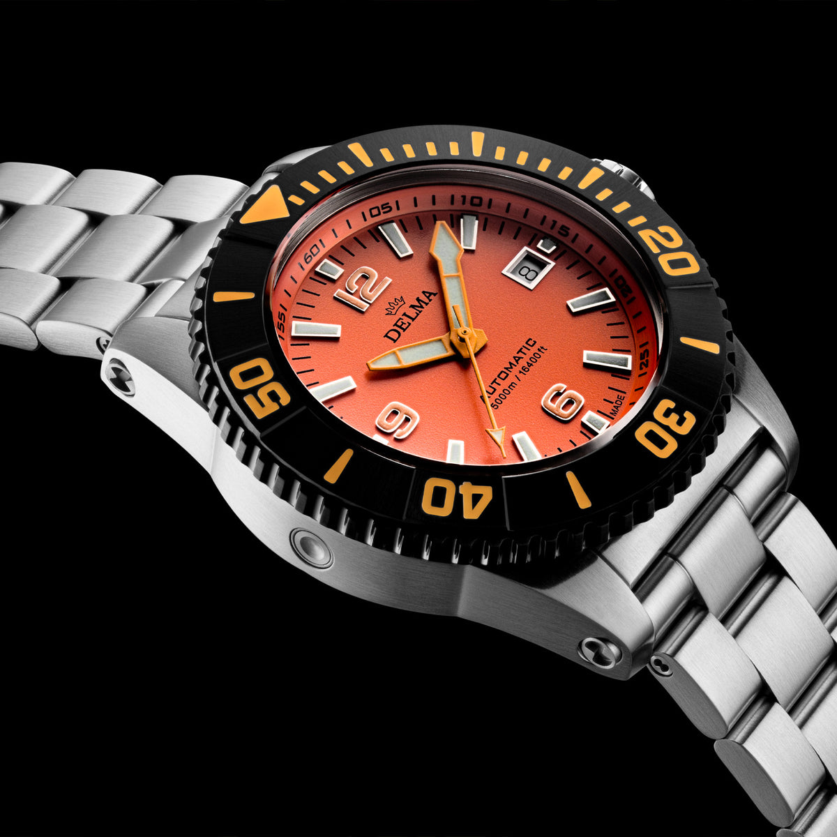DELMA Blue Shark IV stainless steel watch with orange dial and black bezel close up