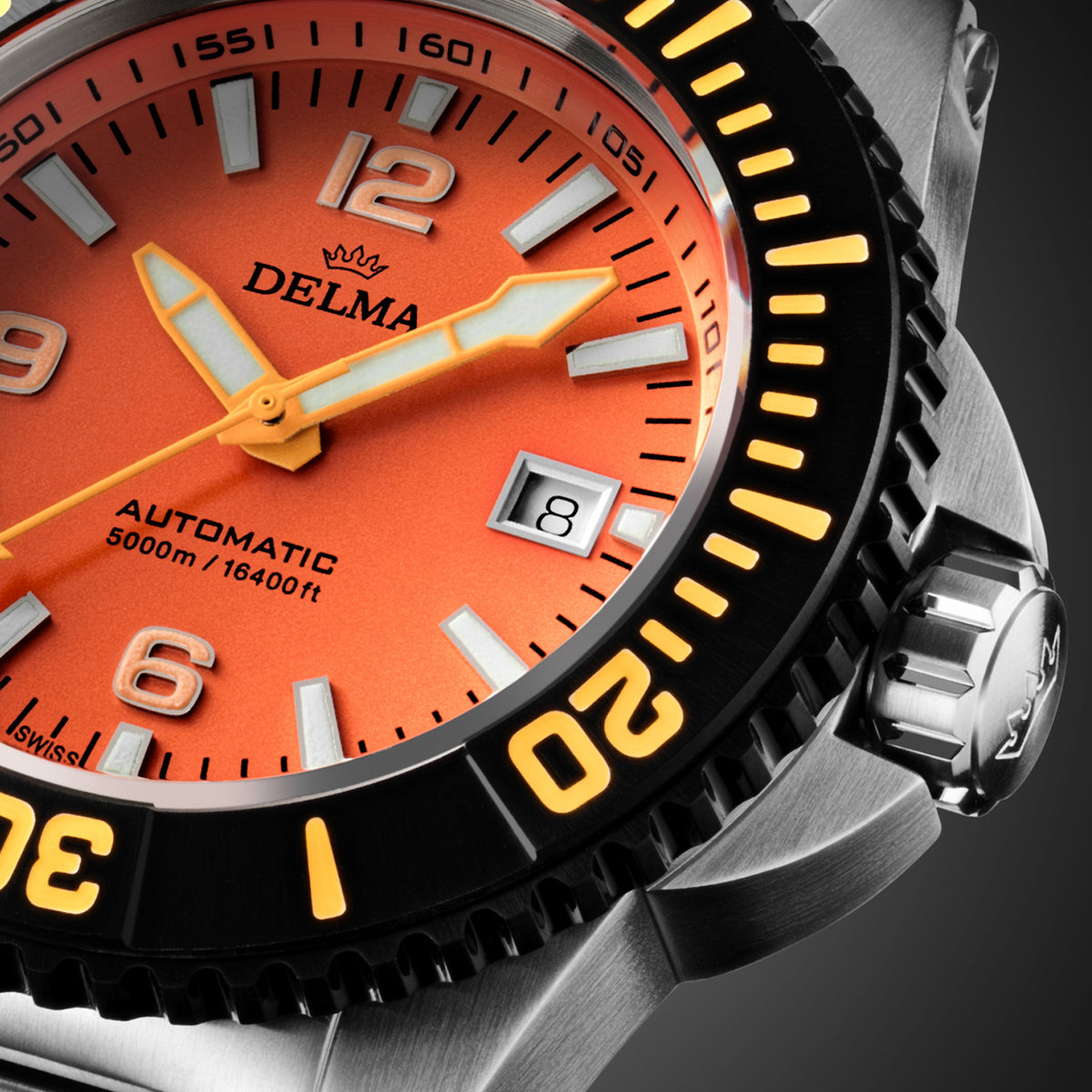 DELMA Blue Shark IV stainless steel watch with orange dial and black bezel close up