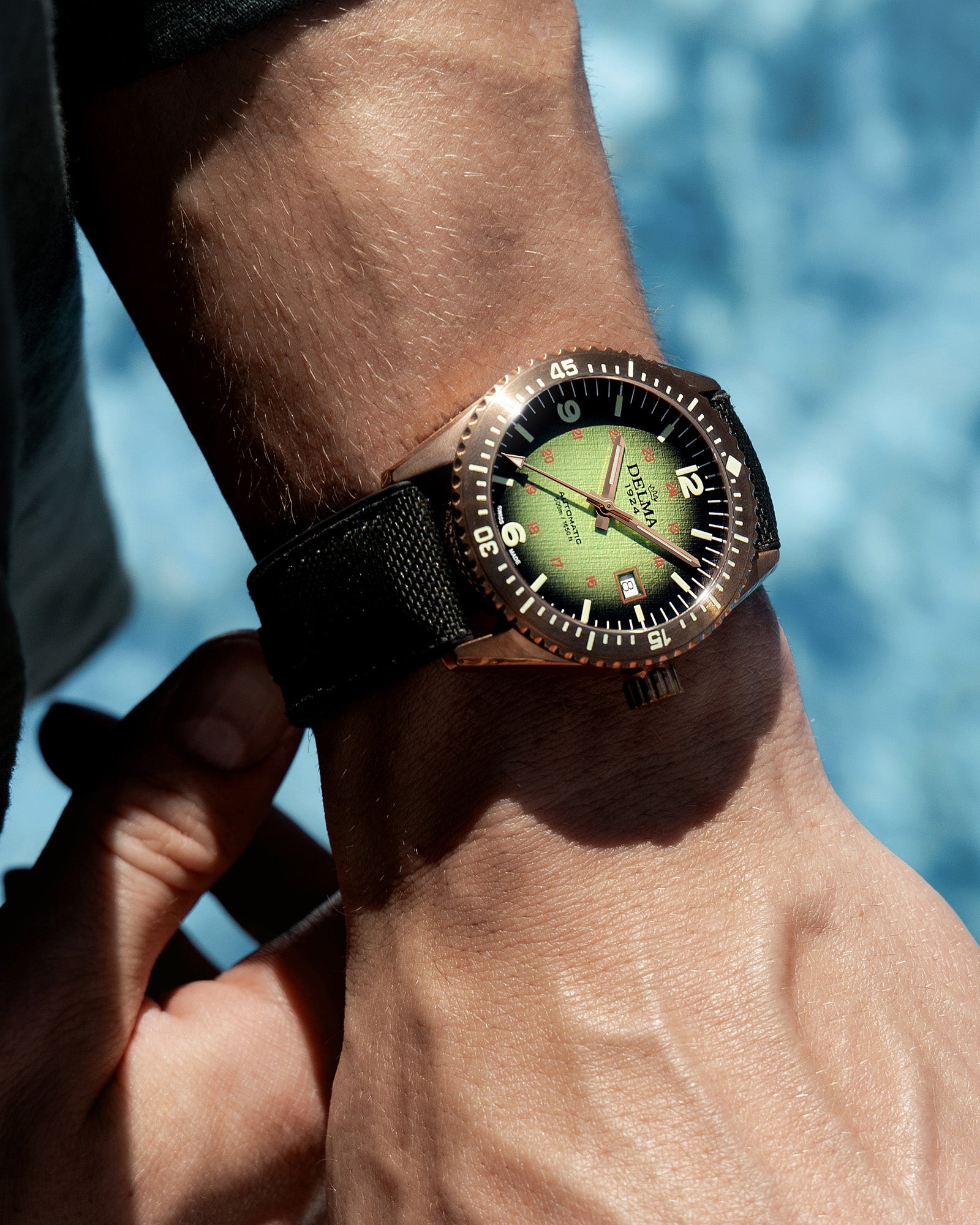DELMA Cayman Bronze watch with green gradient dial and green Cordura strap