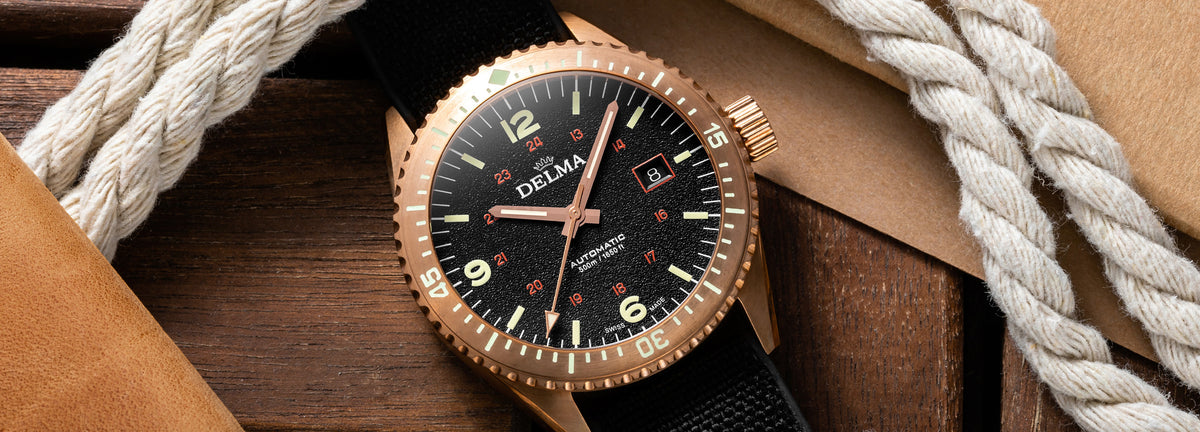 DELMA Cayman Bronze watch with black dial and black Cordura strap in context