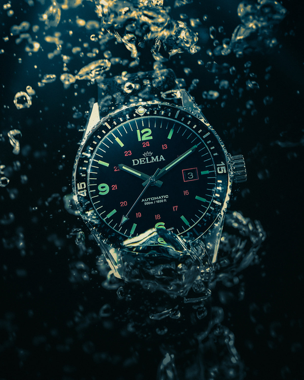 DELMA Cayman Field stainless steel watch with black dial and black rubber strap under water