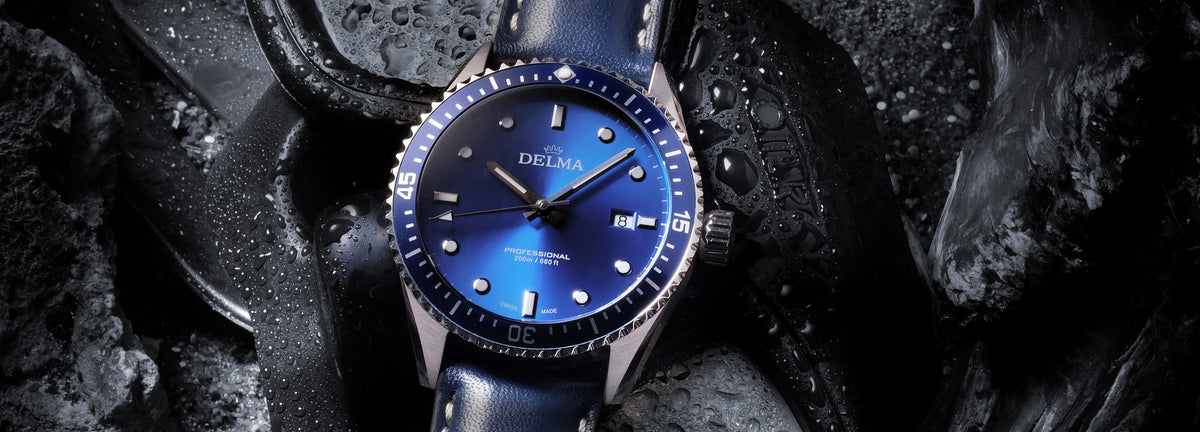 DELMA Cayman stainless steel watch with blue dial, bezel and leather strap