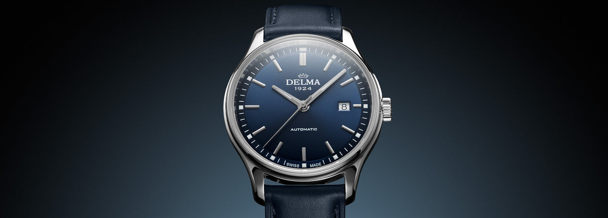 DELMA Classic stainless steel watch with blue dial and blue leather strap close up