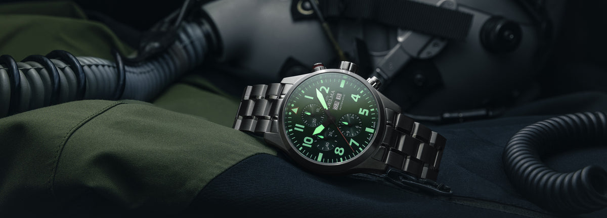DELMA Commander Chronograph stainless steel watch with green dial lume in context