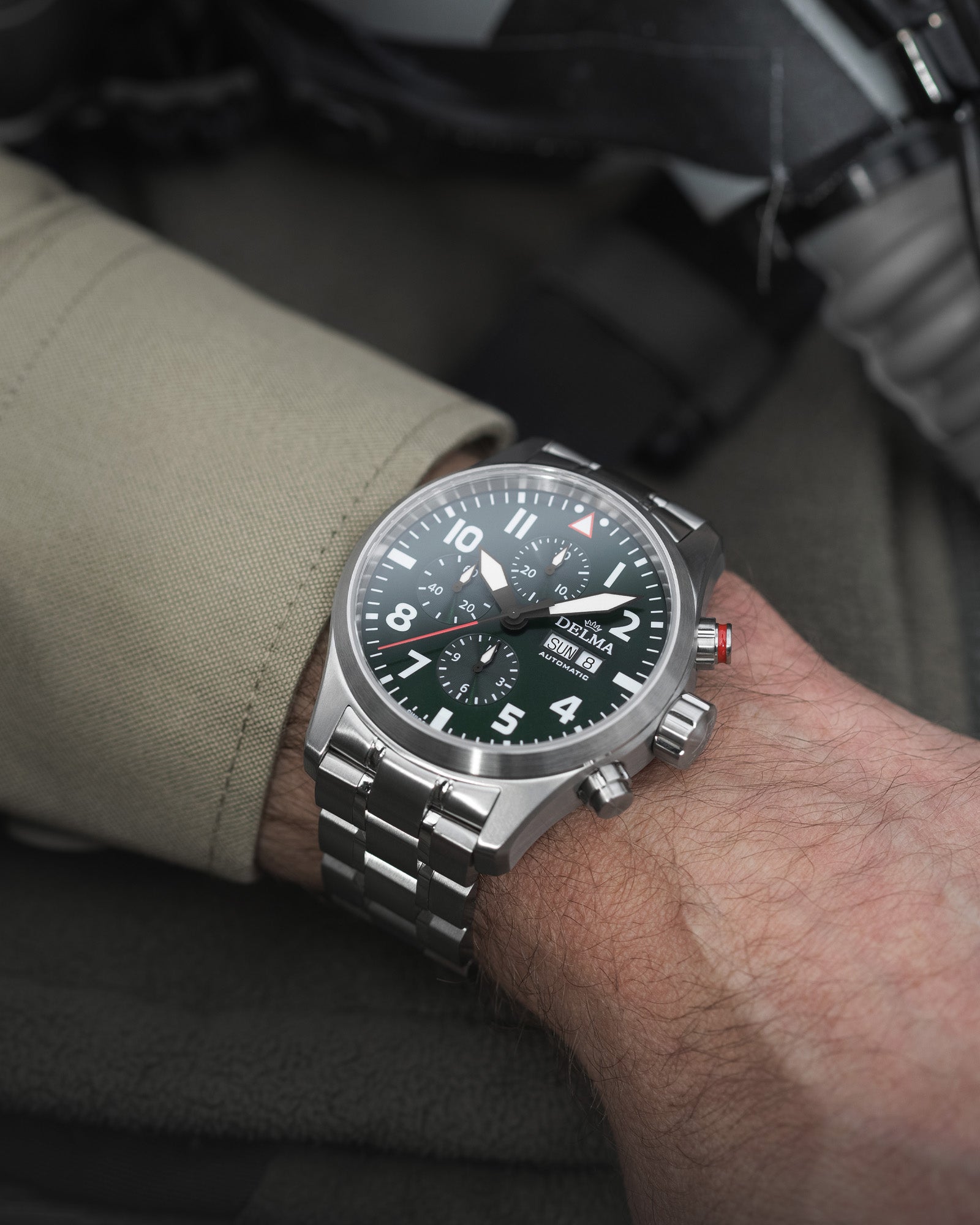 DELMA Commander Chronograph stainless steel watch with green dial on wrist