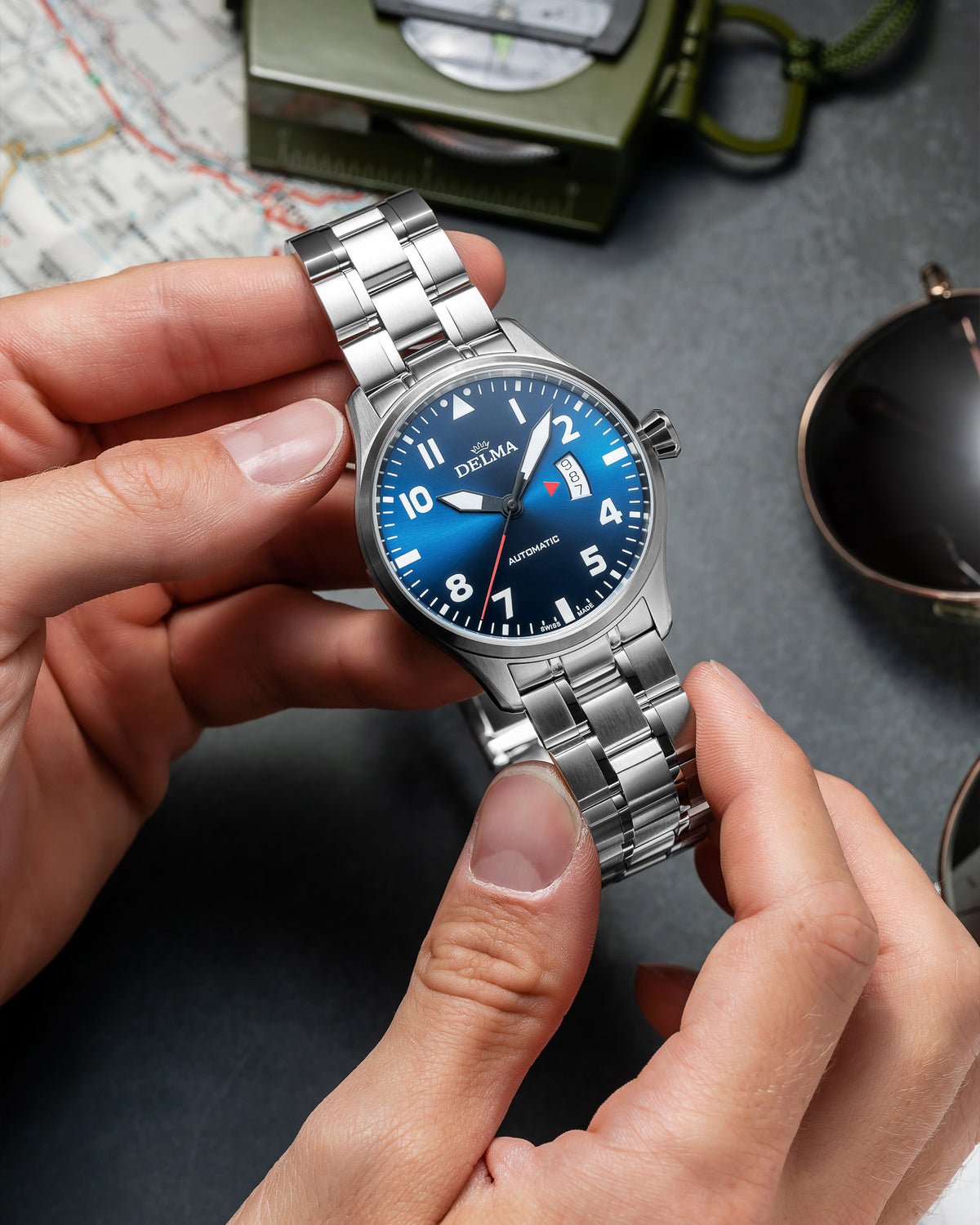 DELMA Commander stainless steel watch with blue dial hands on