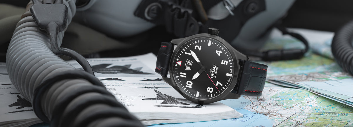 DELMA Commander Big Date stainless steel and black PVD watch with black dial and black leather strap in context