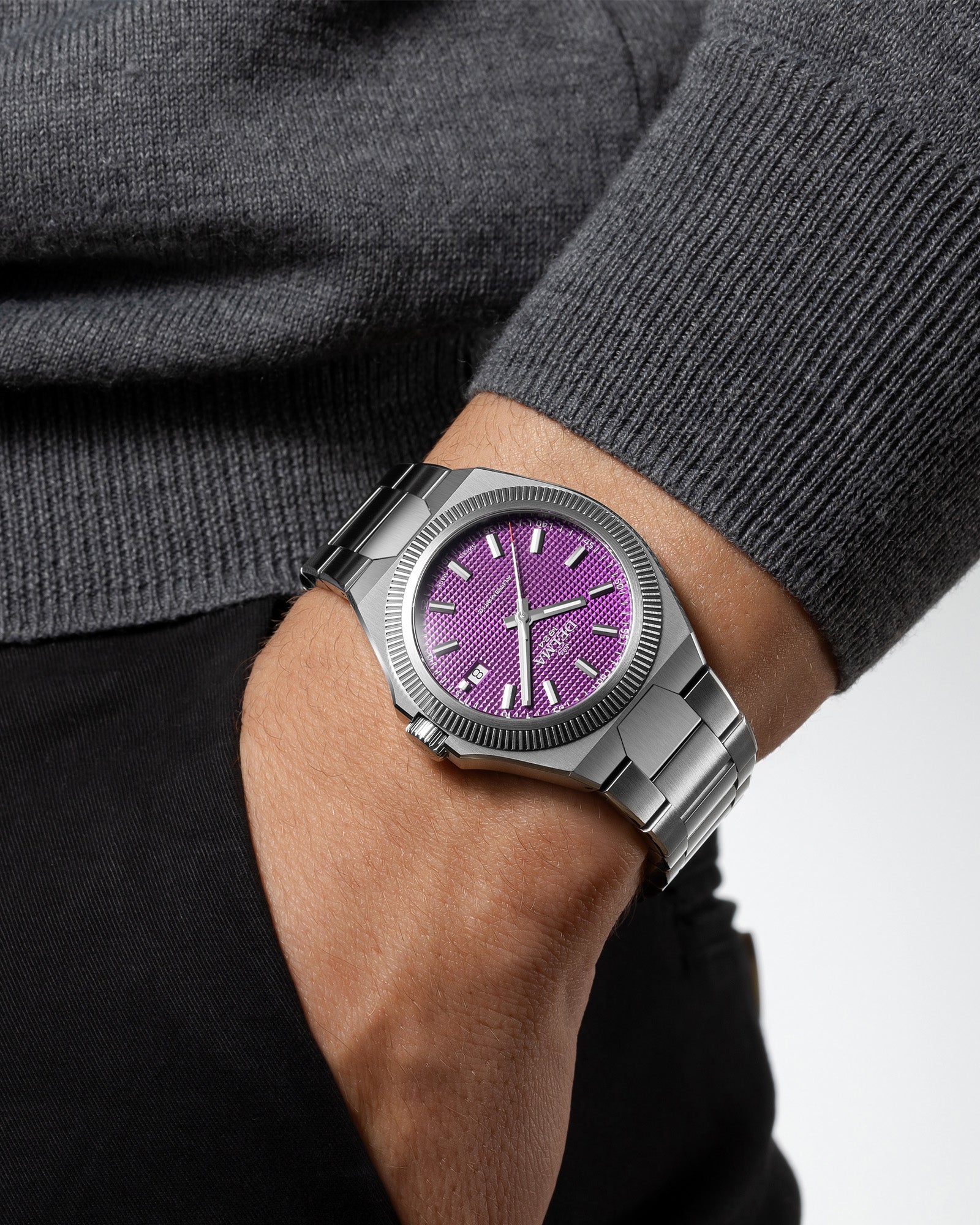 DELMA Midland Automatic 40 mm stainless steel watch with purple dial on wrist