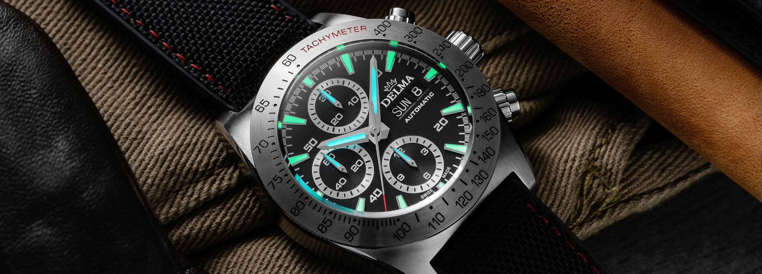 DELMA Montego stainless steel watch with black dial and black Cordura strap lume