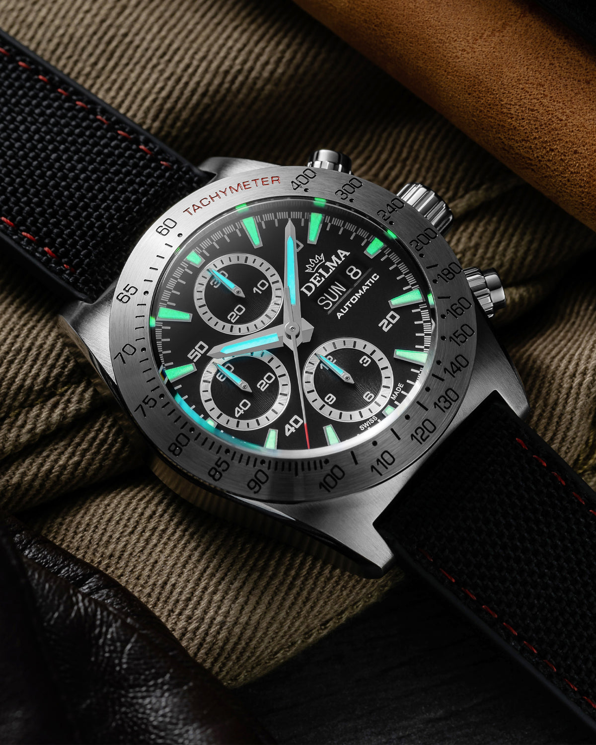 DELMA Montego stainless steel watch with green dial and black Cordura strap lume